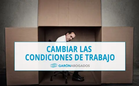 Hombre dentro de una caja de cartón, con texto "CAMBIAR LAS CONDICIONES DE TRABAJO". Posible referencia al art. 41 ET.