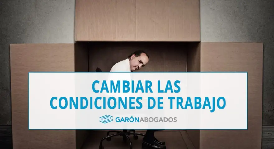 Hombre dentro de una caja de cartón, con texto "CAMBIAR LAS CONDICIONES DE TRABAJO". Posible referencia al art. 41 ET.